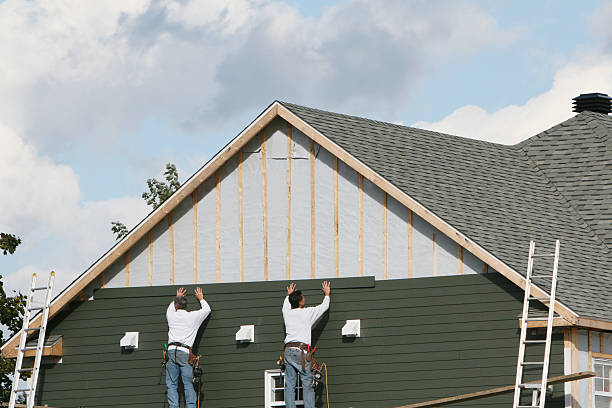 Professional Siding technician working in Loveville, MD